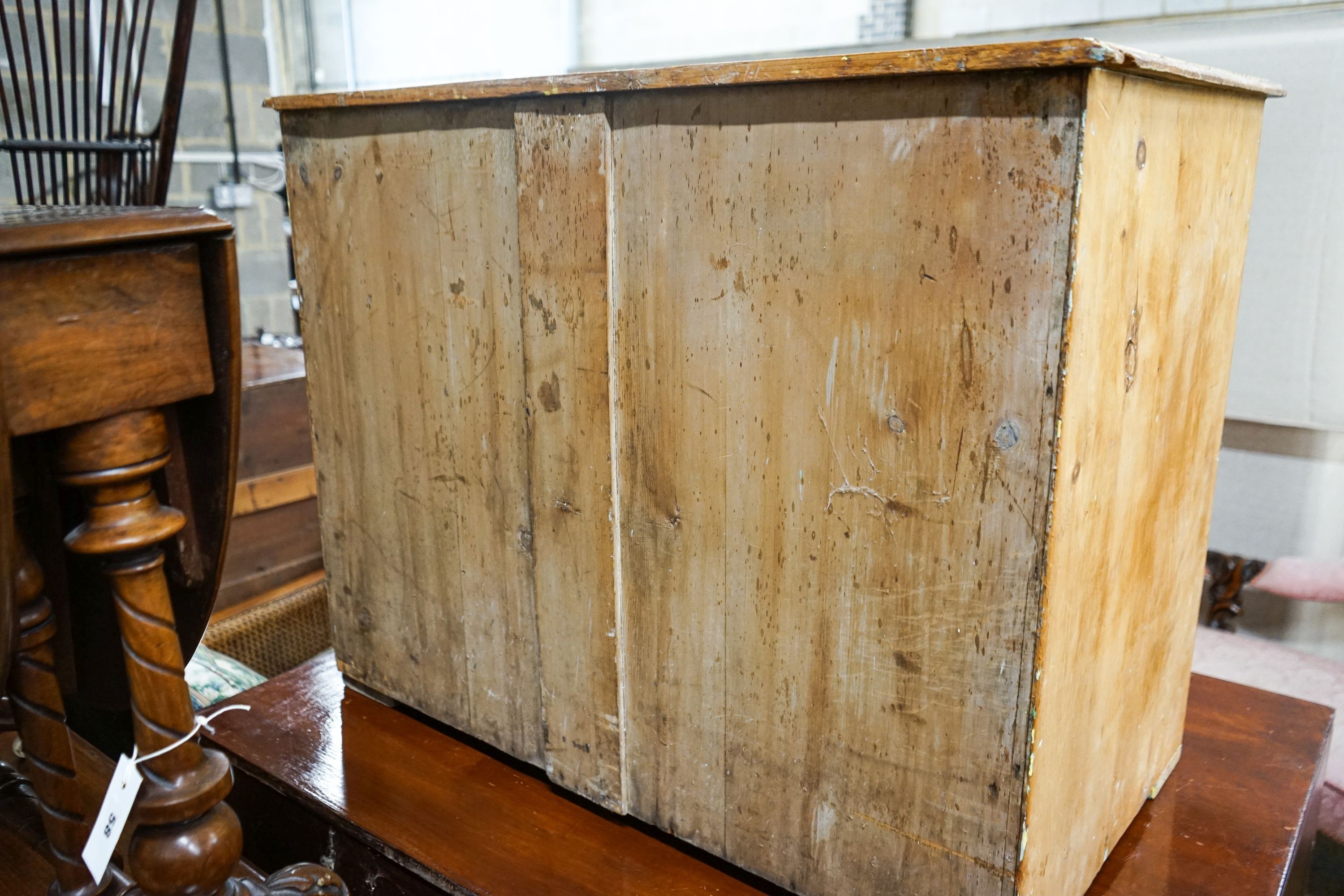 A Victorian stripped pine chest of drawers (lacking feet), width 95cm, depth 53cm, height 74cm